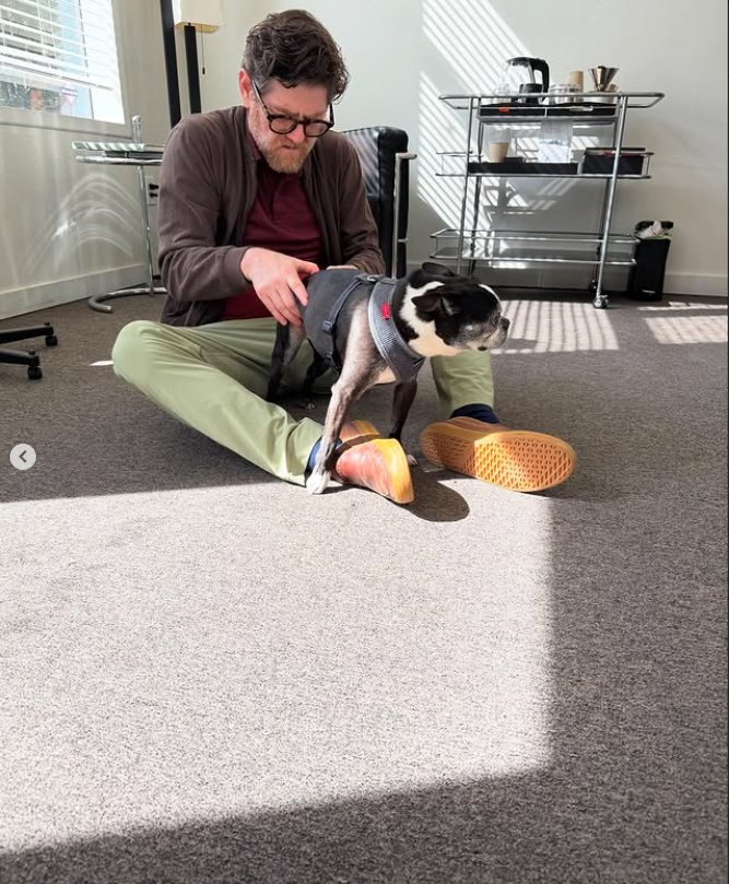 Dr. Nick Wise with Beyoncé the office dog at Wise Chiropractic Portland