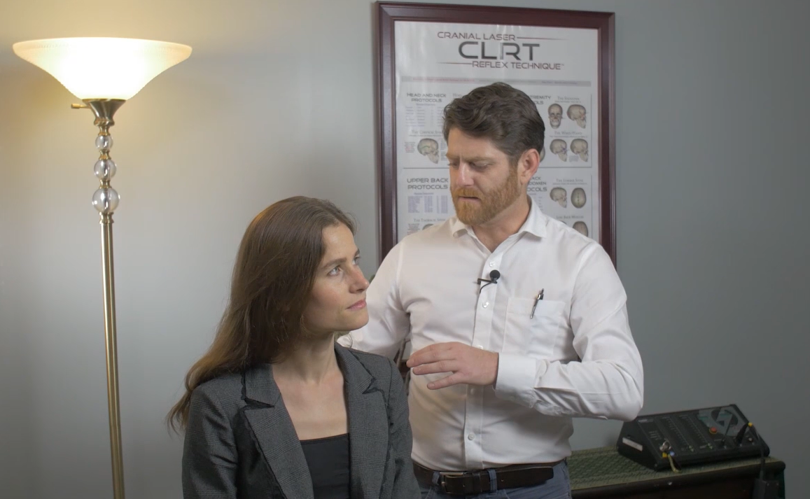 Dr. Nick Wise performing Cranial Laser Reflex Technique (CLRT) on a patient at Wise Chiropractic Pearl District Portland