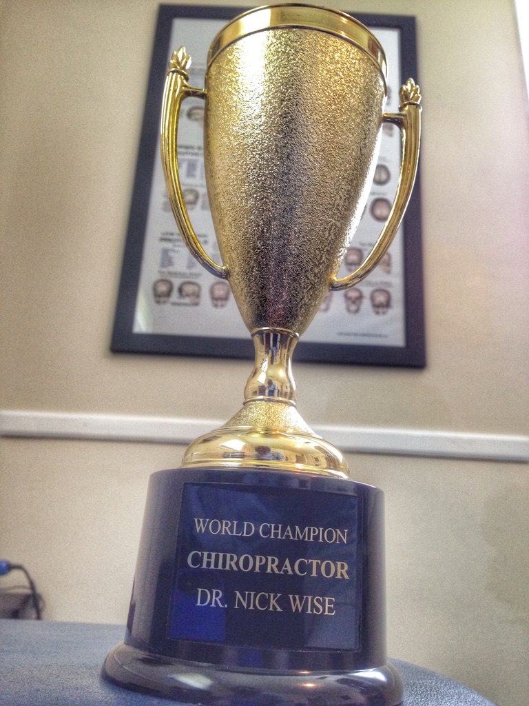 World Champion Chiropractor trophy — a patient had this made for Dr. Nick Wise